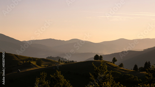 Sunset in the mountains. The early evening sun illuminates the mountains