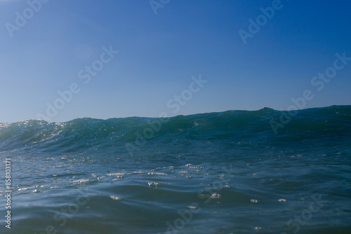 Beautiful small blue wave on the beach. © AlexandraDaryl