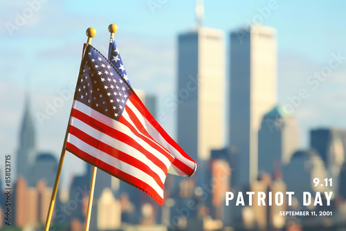 American flags in focus with city skyline and Twin Towers in bac