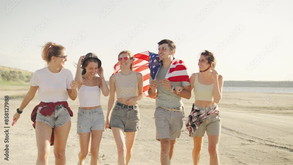 Group of friends joyfully walking and celebrating with an American flag in the desert, capturing a moment of unity and patriotism Group of friends joyfully walking and celebrating with an American flag in the desert, capturing a moment of unity and patriotism