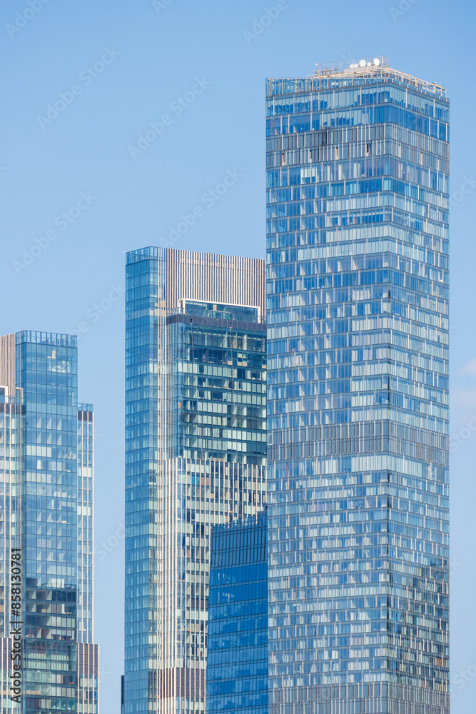 Obraz premium Modern skyscrapers against the sky. View of residential and office high-rise buildings. Close-up.