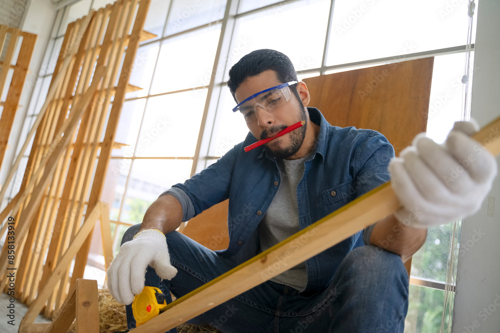 Carpenter is working at woodshop. Carpenter is working at woodshop.