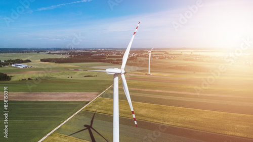 Wind turbine in fields illustrating sustainable future and wind power