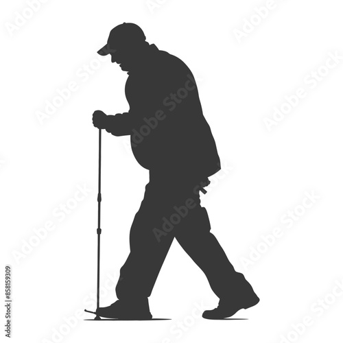 Silhouette of an elderly man with trekking poles walking.