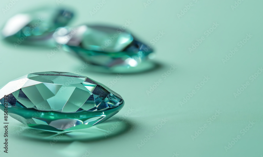 Minimalist Cyan Gemstones on Green Background