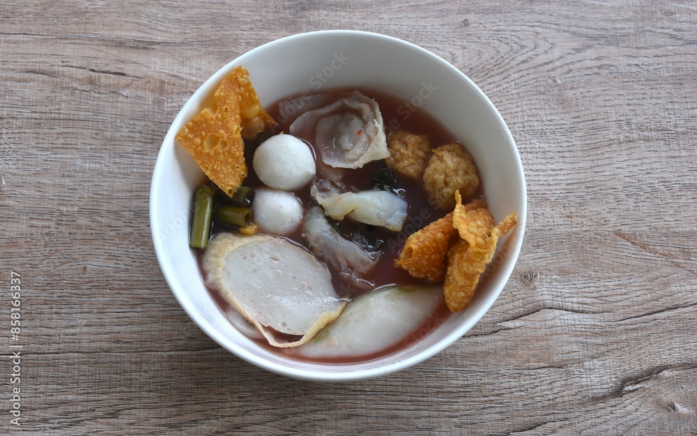 boiled fish and shrimp ball couple dumpling topping pickled cuttlefish in red soybean sauce soup on bowl boiled fish and shrimp ball couple dumpling topping pickled cuttlefish in red soybean sauce soup on bowl
