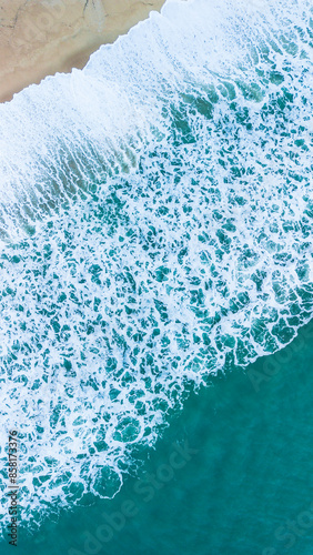 Waves breaking on the beach photo