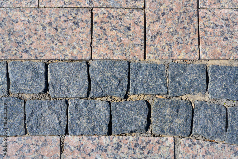A close-up view of the granite stones of the pavement in the ancient fortress of the Kremlin in Nizhny Novgorod A close-up view of the granite stones of the pavement in the ancient fortress of the Kremlin in Nizhny Novgorod