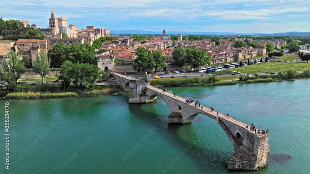 Aerial view of ruins of medieval bridge, with 4 arches spanning the Rhone and a small chapel. Pont Saint-Bénezet bridge in France. Aerial view of ruins of medieval bridge, with 4 arches spanning the Rhone and a small chapel. Pont Saint-Bénezet bridge in France.