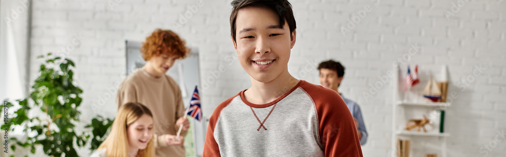 A teenager smiles while participating in a UN model simulation. A teenager smiles while participating in a UN model simulation.