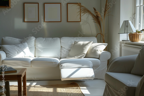 white sofa and recliner chair in scandinavian apartment with modern interior room design with plants