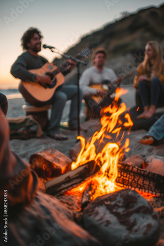 Friends Enjoying Acoustic Music and Campfire on the Beach at Sunset