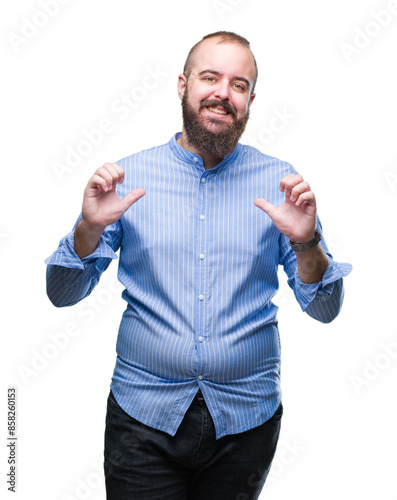 Young caucasian hipster man over isolated background looking confident with smile on face, pointing oneself with fingers proud and happy.