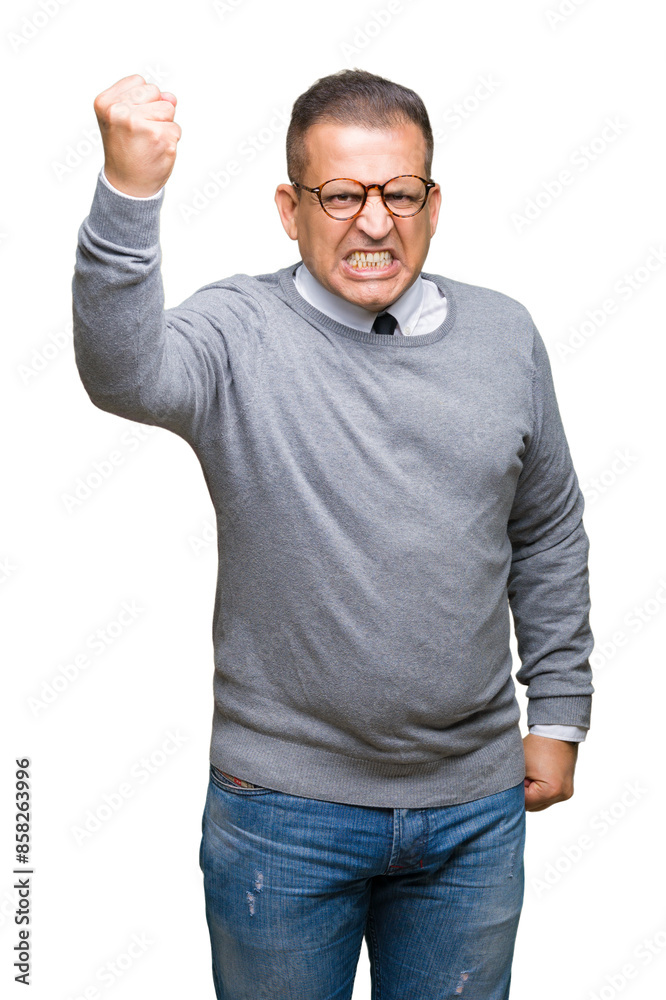 Middle age bussines arab man wearing glasses over isolated background angry and mad raising fist frustrated and furious while shouting with anger. Rage and aggressive concept. Middle age bussines arab man wearing glasses over isolated background angry and mad raising fist frustrated and furious while shouting with anger. Rage and aggressive concept.