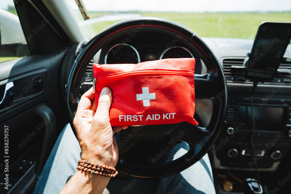 Fototapeta premium Its crucial to keep a first aid kit in your car for safety while driving, especially for long road journeys and unexpected situations. Be prepared in advance for any emergencies