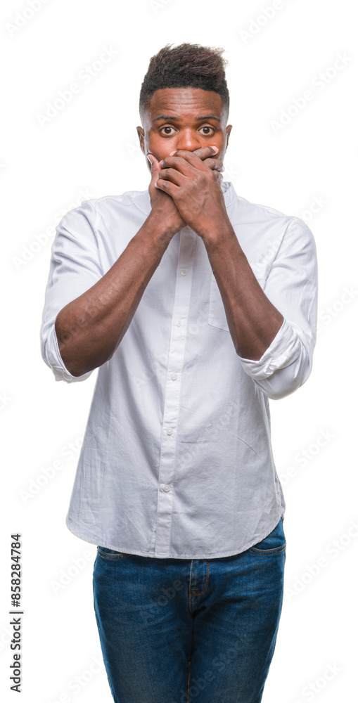 Young african american man over isolated background shocked covering mouth with hands for mistake. Secret concept.