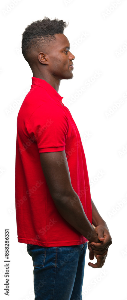 Young african american man over isolated background looking to side, relax profile pose with natural face with confident smile.