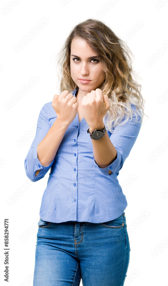 Beautiful young blonde business woman over isolated background Ready to fight with fist defense gesture, angry and upset face, afraid of problem Beautiful young blonde business woman over isolated background Ready to fight with fist defense gesture, angry and upset face, afraid of problem