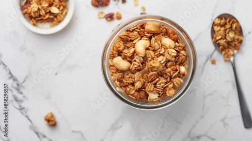 Crunchy Peanut Butter Granola in Glass Jar on Marble Table, Top View
