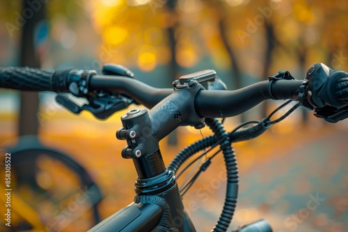 Handbrake and handlebar on a bicycle. Hand brakes located on a bicycle's steering wheel handle. Brakes and gear shift on a bike.