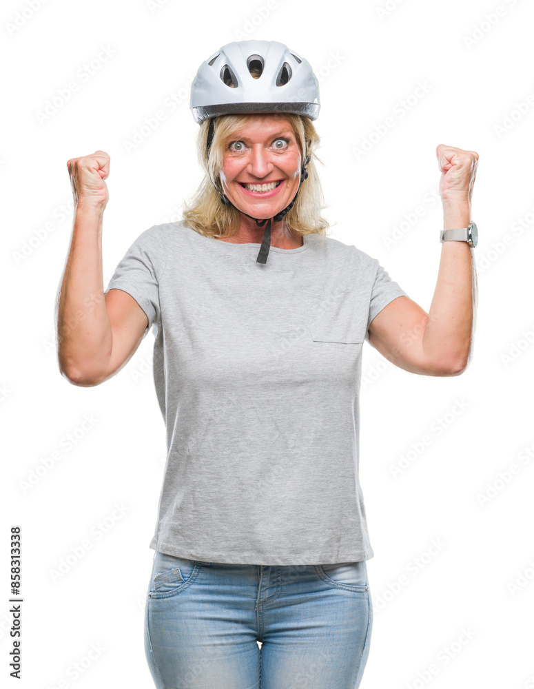 Middle age caucasian cyclist woman wearing safety helmet over isolated background celebrating surprised and amazed for success with arms raised and open eyes. Winner concept. Middle age caucasian cyclist woman wearing safety helmet over isolated background celebrating surprised and amazed for success with arms raised and open eyes. Winner concept.