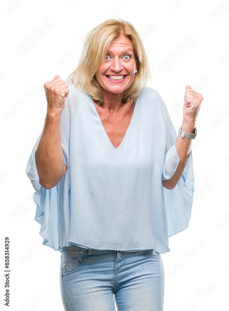 Middle age blonde business woman over isolated background very happy and excited doing winner gesture with arms raised, smiling and screaming for success. Celebration concept. Middle age blonde business woman over isolated background very happy and excited doing winner gesture with arms raised, smiling and screaming for success. Celebration concept.