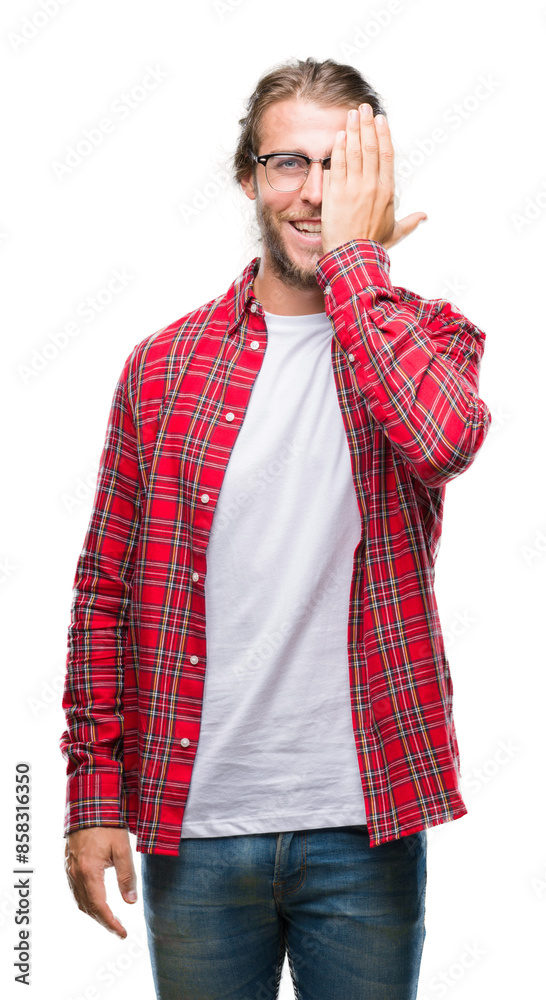Young handsome man with long hair wearing glasses over isolated background covering one eye with hand with confident smile on face and surprise emotion. Young handsome man with long hair wearing glasses over isolated background covering one eye with hand with confident smile on face and surprise emotion.