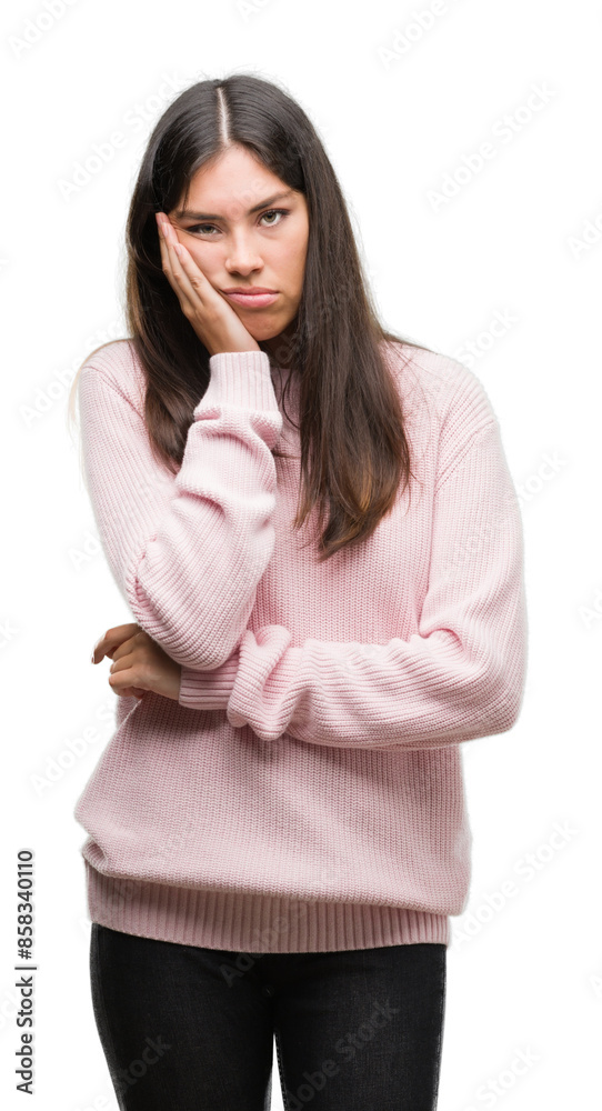 Young beautiful hispanic woman wearing a sweater thinking looking tired and bored with depression problems with crossed arms.
