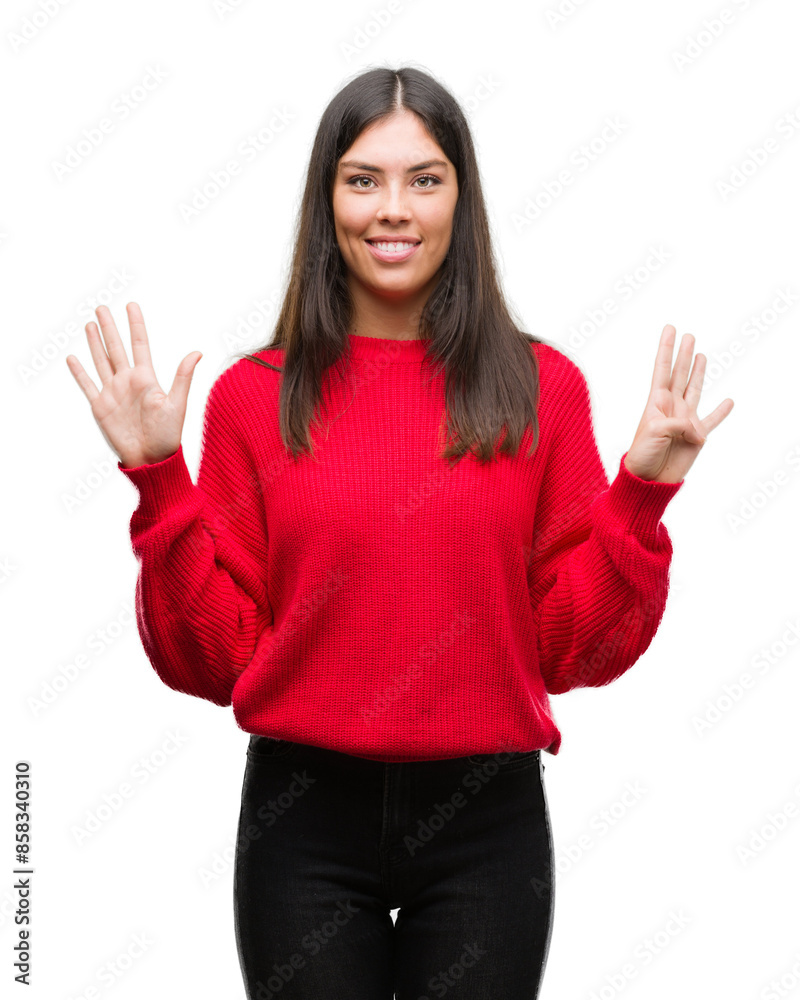 Young beautiful hispanic wearing red sweater showing and pointing up with fingers number nine while smiling confident and happy. Young beautiful hispanic wearing red sweater showing and pointing up with fingers number nine while smiling confident and happy.