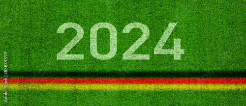 Grüner Fussballrasen mit deutschem Banner in den Nationalfarben schwarz rot gold