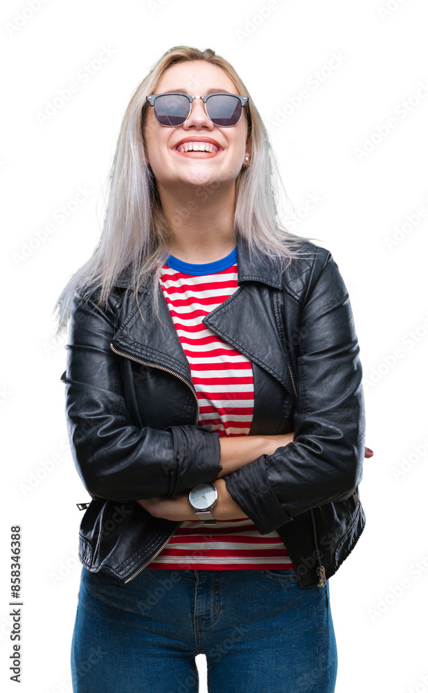Young blonde woman wearing fashion jacket and sunglasses over isolated background happy face smiling with crossed arms looking at the camera. Positive person. Young blonde woman wearing fashion jacket and sunglasses over isolated background happy face smiling with crossed arms looking at the camera. Positive person.