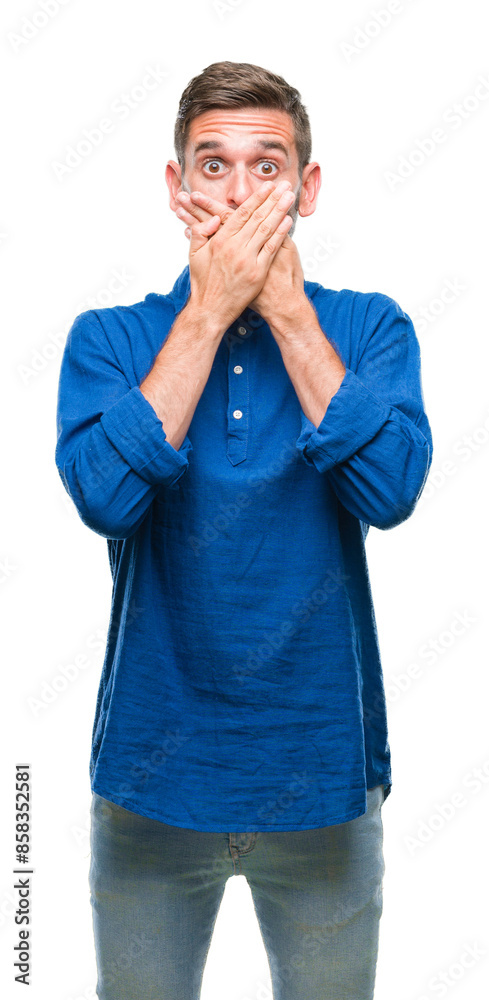 Young handsome man over isolated background shocked covering mouth with hands for mistake. Secret concept.
