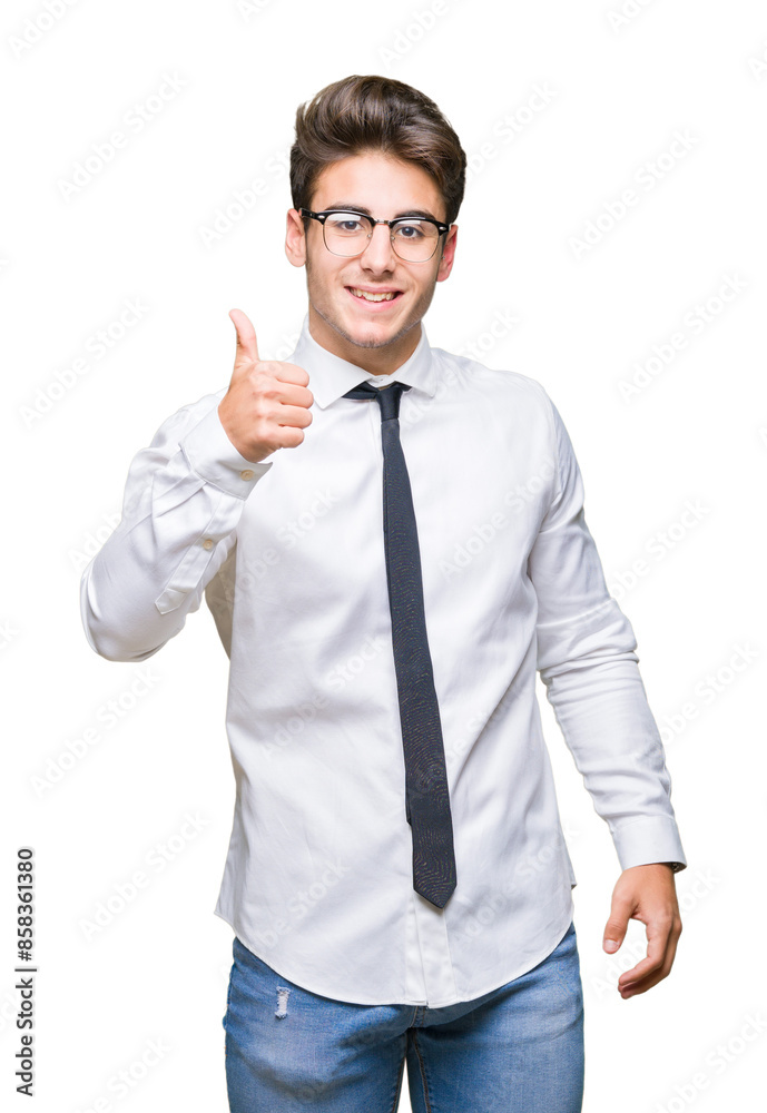 Young business man wearing glasses over isolated background doing happy thumbs up gesture with hand. Approving expression looking at the camera showing success. Young business man wearing glasses over isolated background doing happy thumbs up gesture with hand. Approving expression looking at the camera showing success.