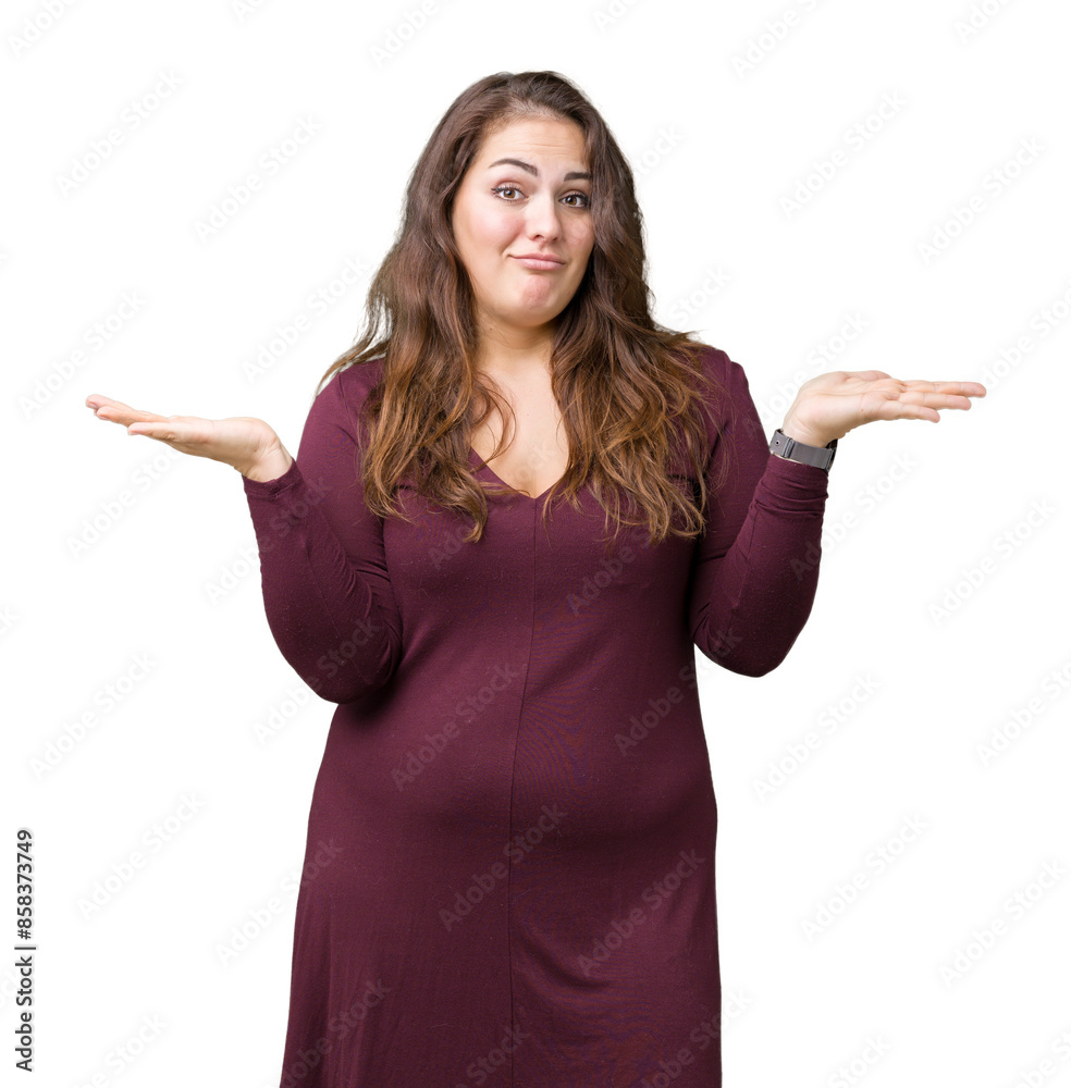 Beautiful and attractive plus size young woman wearing a dress over isolated background clueless and confused expression with arms and hands raised. Doubt concept. Beautiful and attractive plus size young woman wearing a dress over isolated background clueless and confused expression with arms and hands raised. Doubt concept.
