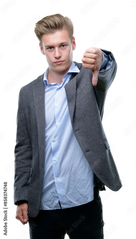 Young handsome blond business man looking unhappy and angry showing rejection and negative with thumbs down gesture. Bad expression. Young handsome blond business man looking unhappy and angry showing rejection and negative with thumbs down gesture. Bad expression.