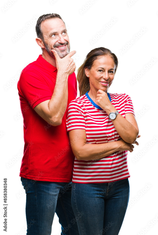 Middle age hispanic couple in love over isolated background looking confident at the camera with smile with crossed arms and hand raised on chin. Thinking positive. Middle age hispanic couple in love over isolated background looking confident at the camera with smile with crossed arms and hand raised on chin. Thinking positive.