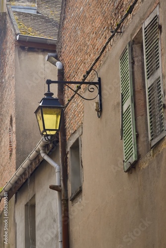 Obraz na płótnie Vintage street lamp screwed to a wall in France w salonie