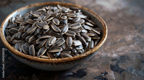 Sunflower seeds in a white ceramic bowl