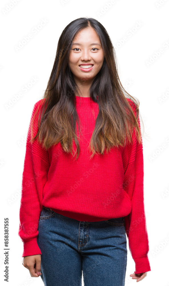 Young asian woman wearing winter sweater over isolated background with a happy and cool smile on face. Lucky person. Young asian woman wearing winter sweater over isolated background with a happy and cool smile on face. Lucky person.