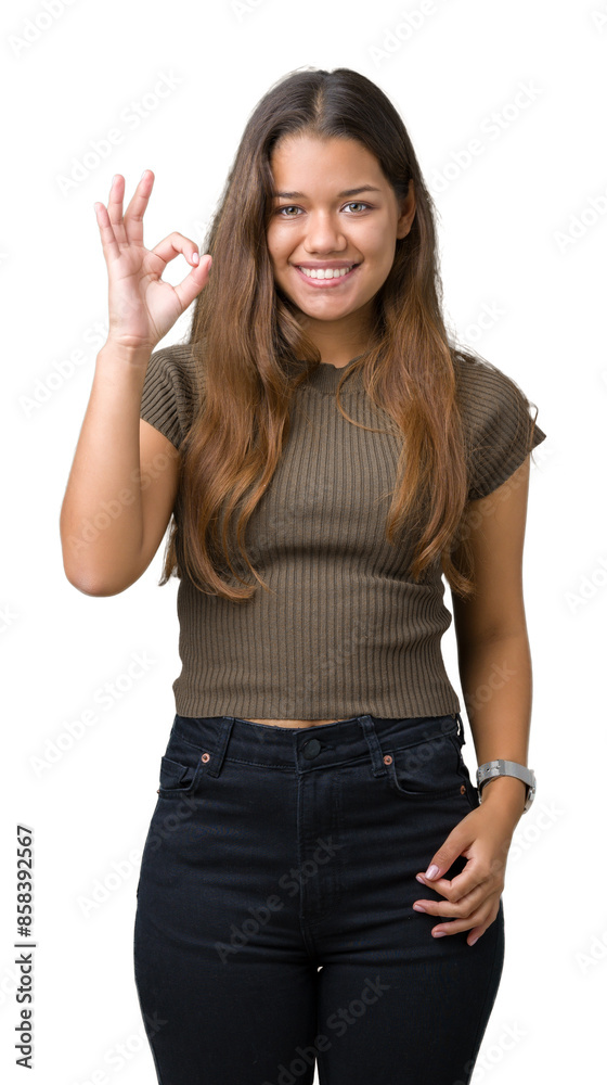 Young beautiful brunette woman over isolated background smiling positive doing ok sign with hand and fingers. Successful expression. Young beautiful brunette woman over isolated background smiling positive doing ok sign with hand and fingers. Successful expression.