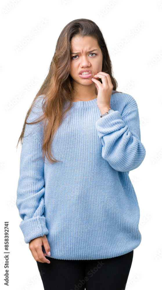 Young beautiful brunette woman wearing blue winter sweater over isolated background touching mouth with hand with painful expression because of toothache or dental illness on teeth. Dentist concept. Young beautiful brunette woman wearing blue winter sweater over isolated background touching mouth with hand with painful expression because of toothache or dental illness on teeth. Dentist concept.