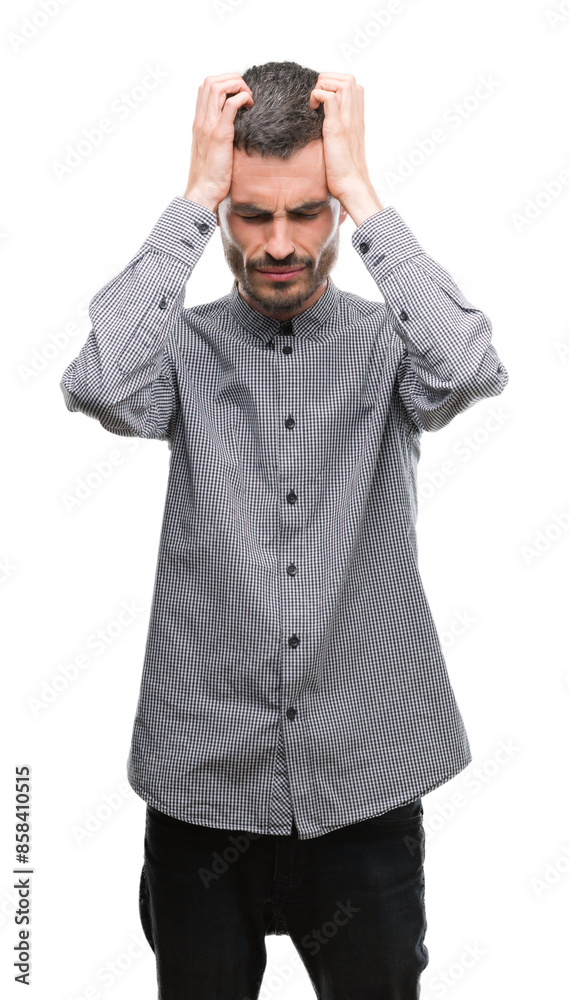 Young hipster man suffering from headache desperate and stressed because pain and migraine. Hands on head. Young hipster man suffering from headache desperate and stressed because pain and migraine. Hands on head.