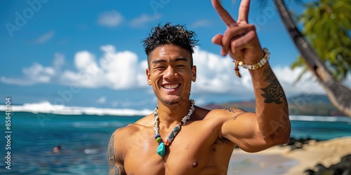 Smiling 22 year old fit Hawaiian male on the tropical beach  photo