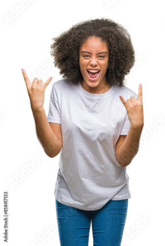 Young afro american woman over isolated background shouting with crazy expression doing rock symbol with hands up. Music star. Heavy concept.