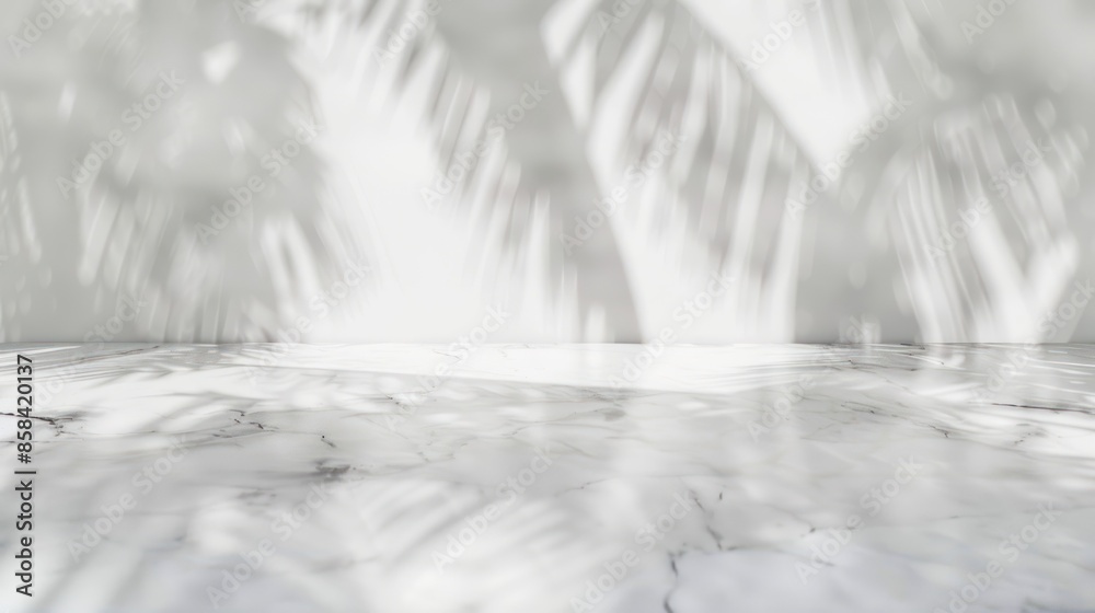 Sunlight casts tropical palm leaf shadows on a marble surface, creating a serene and minimalist natural backdrop.