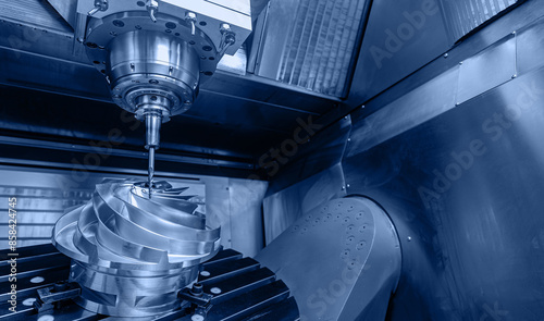 Fotografie Producing turbine wheel and blades part with CNC drill machine five axis lathe