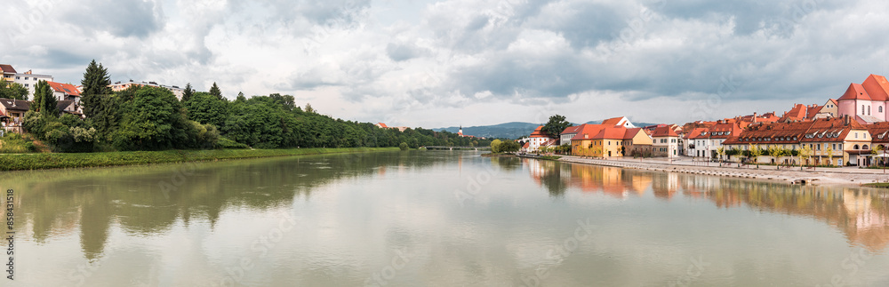 A panorama cityscape of the city Maribor and the river Drava outdoor with nature and buildings A panorama cityscape of the city Maribor and the river Drava outdoor with nature and buildings