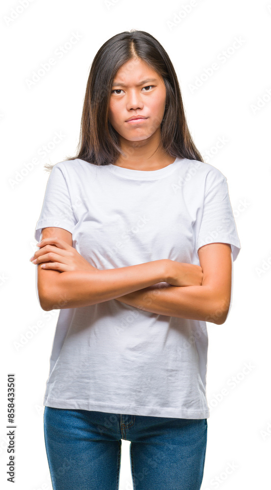 Young asian woman over isolated background skeptic and nervous, disapproving expression on face with crossed arms. Negative person. Young asian woman over isolated background skeptic and nervous, disapproving expression on face with crossed arms. Negative person.