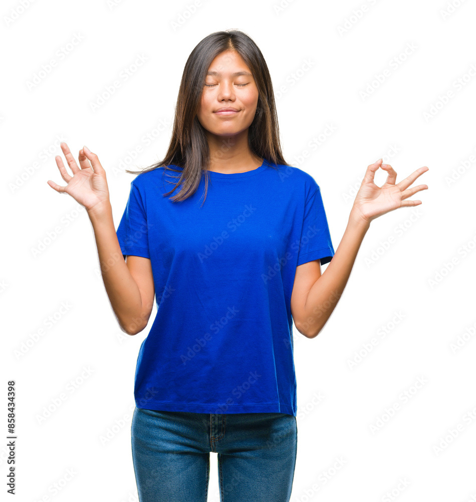 Young asian woman over isolated background relax and smiling with eyes closed doing meditation gesture with fingers. Yoga concept. Young asian woman over isolated background relax and smiling with eyes closed doing meditation gesture with fingers. Yoga concept.