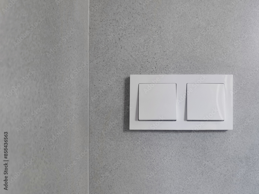 double white european light switch on gray tile wall double white european light switch on gray tile wall